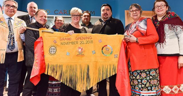 Inauguration ceremony members of health board holding a sign